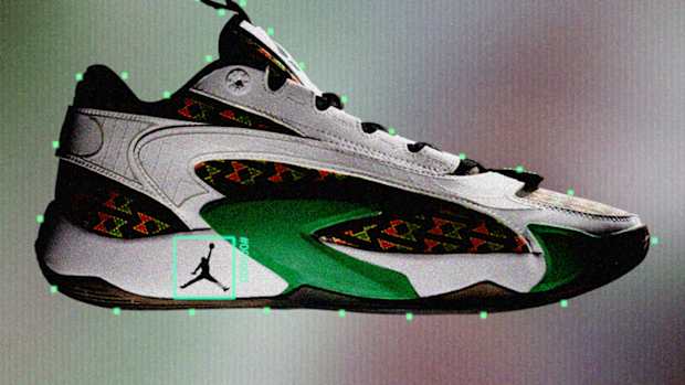 Side view of Luka Doncic's white, black, and green Jordan Brand sneaker.